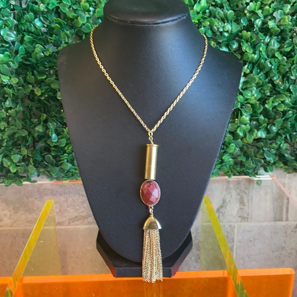 One of a kind bullet casing necklace.